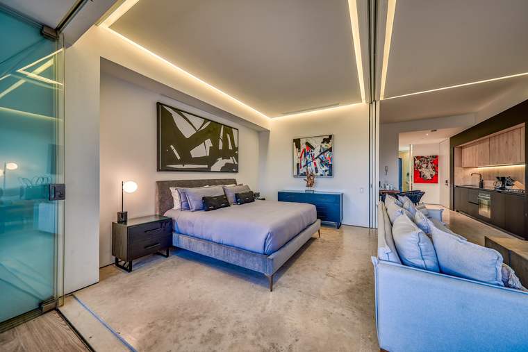 Primary bedroom with soft evening lighting